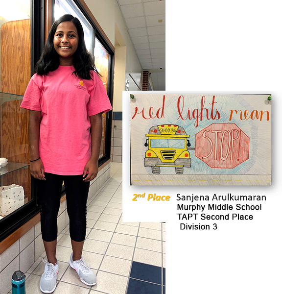 Sanjena Arulkumaran and poster with bus/giant stop sign - red lights mean STOP! 